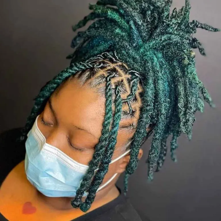 Teal Colored Dreadlocks Tied in a Messy Knot