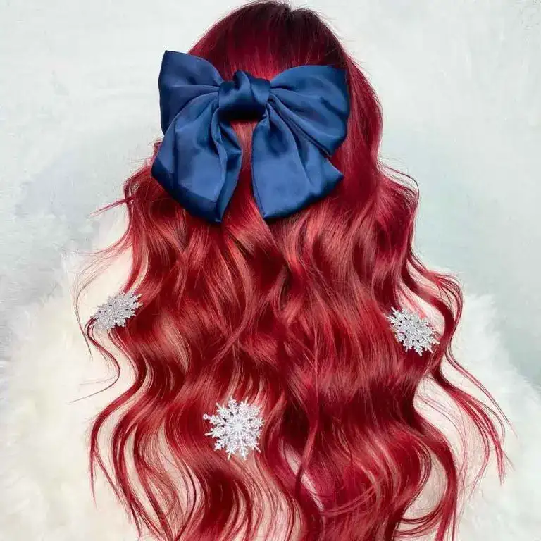 Long Wavy Burgundy Hair With a Satin Blue Bow and Snowflakes