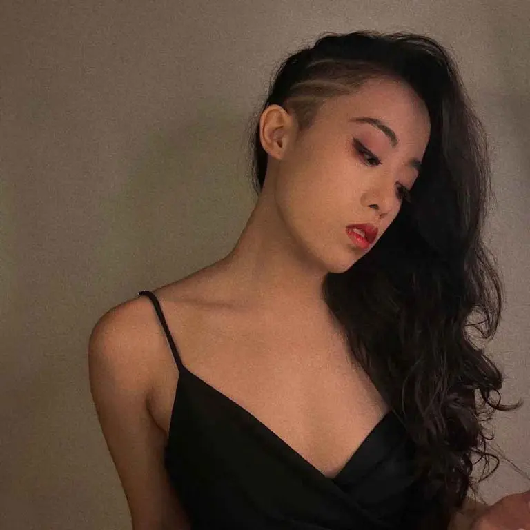 Long Wavy Side-Shaved Hairstyle With Clean Lines