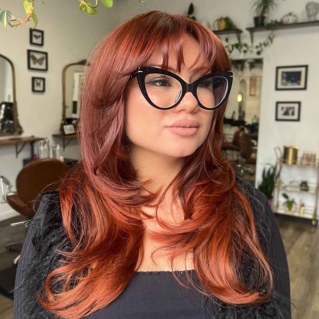 Long Copper Layered Hair With Wispy Bangs