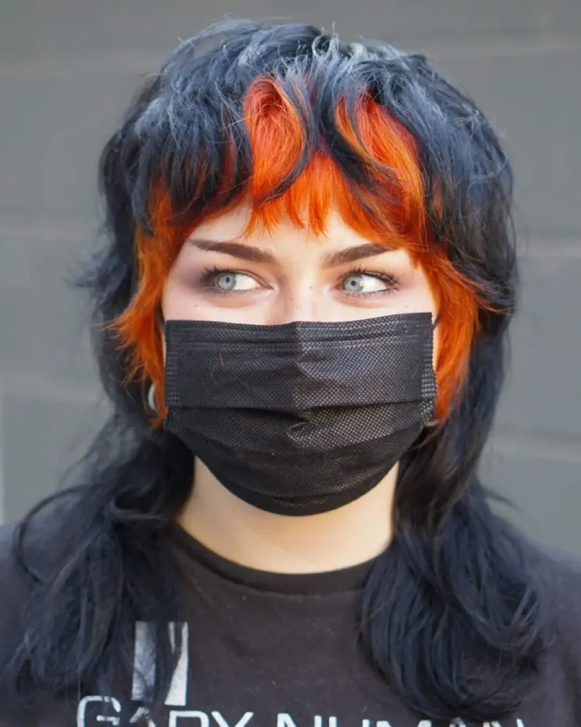 Medium Black Shag-Mullet Wolf Cut With Neon Orange Messy Bangs