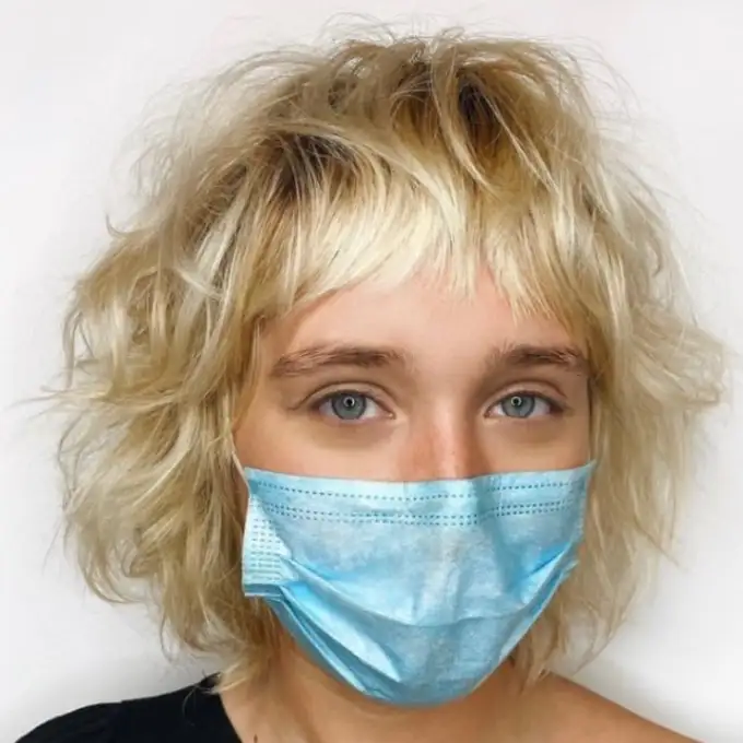 Bleached Blonde Shaggy Bob Cut With Asymmetric Bangs