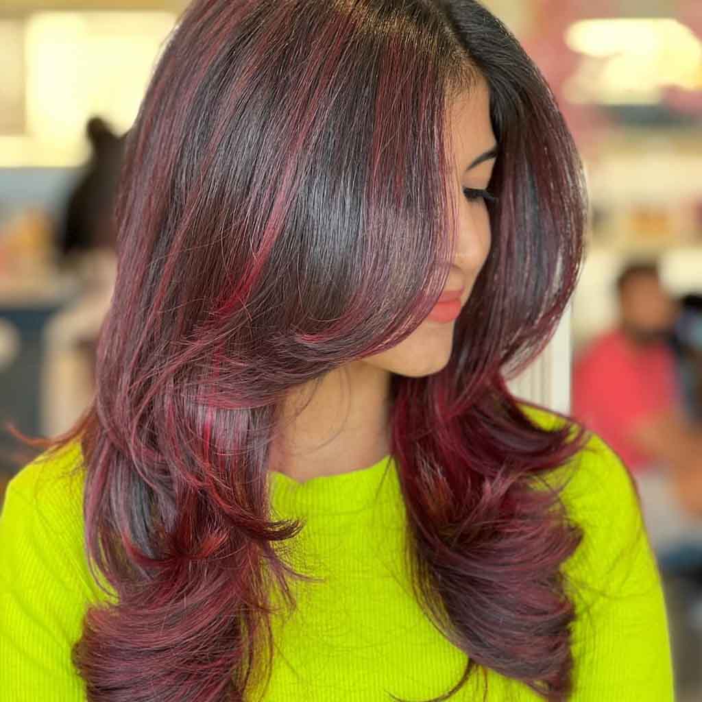 Long Layered Black Hair With Raspberry Highlights