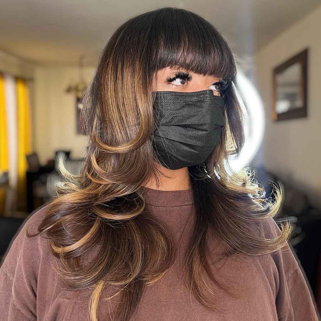 Long Wavy Golden Balayage With Face Framing Layers and Bangs