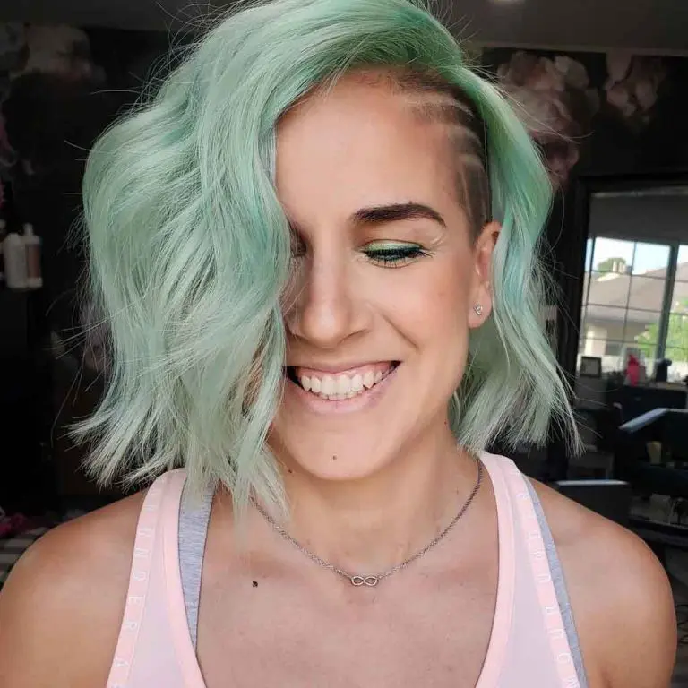 Side-Shaved Wavy Mint Green Hair With Clean Lines
