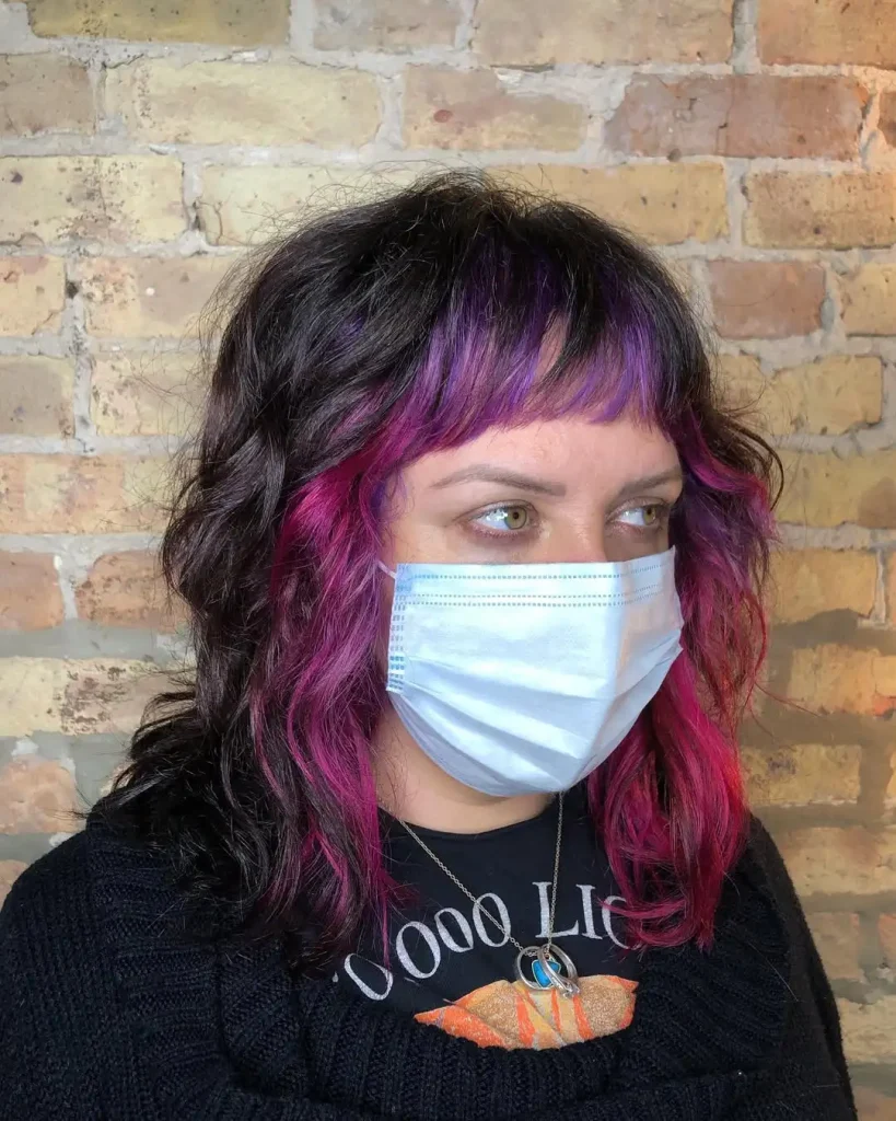 Medium Wolf Cut With Purple-Pink Highlights and Choppy Bangs