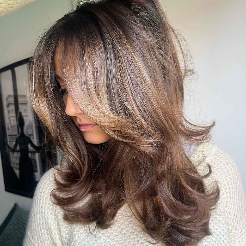 Medium Blow Out Hair With Balayage and Curtain Bangs