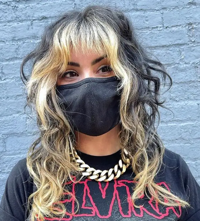 Wavy Tousled Wolf Cut With Bleached Blonde Short Choppy Bangs and Highlights