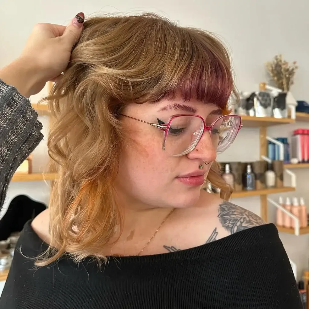 Short Wavy Dark Blonde Wolf Cut With Fall-Colored Blunt Bangs
