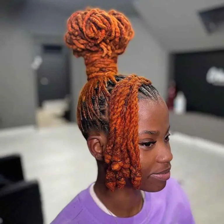 Orange Rope Locks and Dreadlocks Tied in a Mushroom Bun