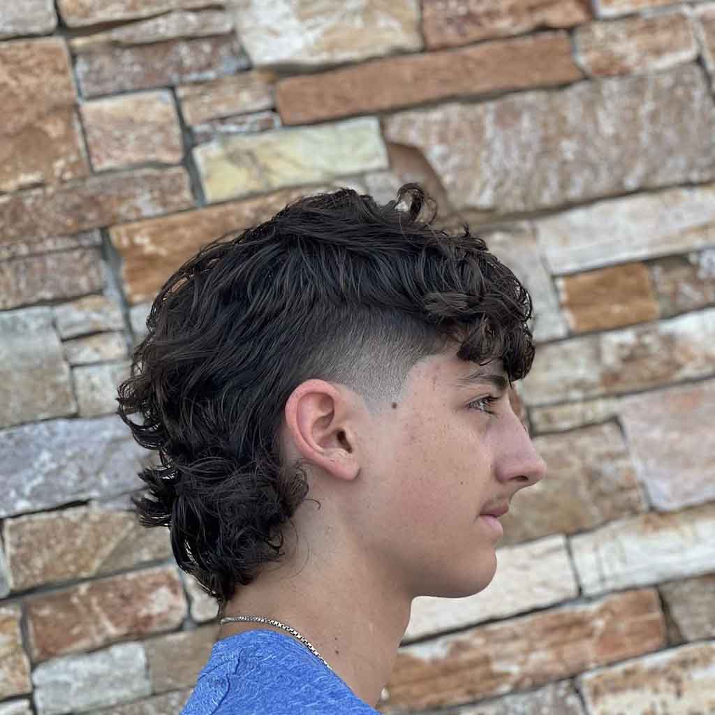6. Permed Mullet With Low Skin Fade