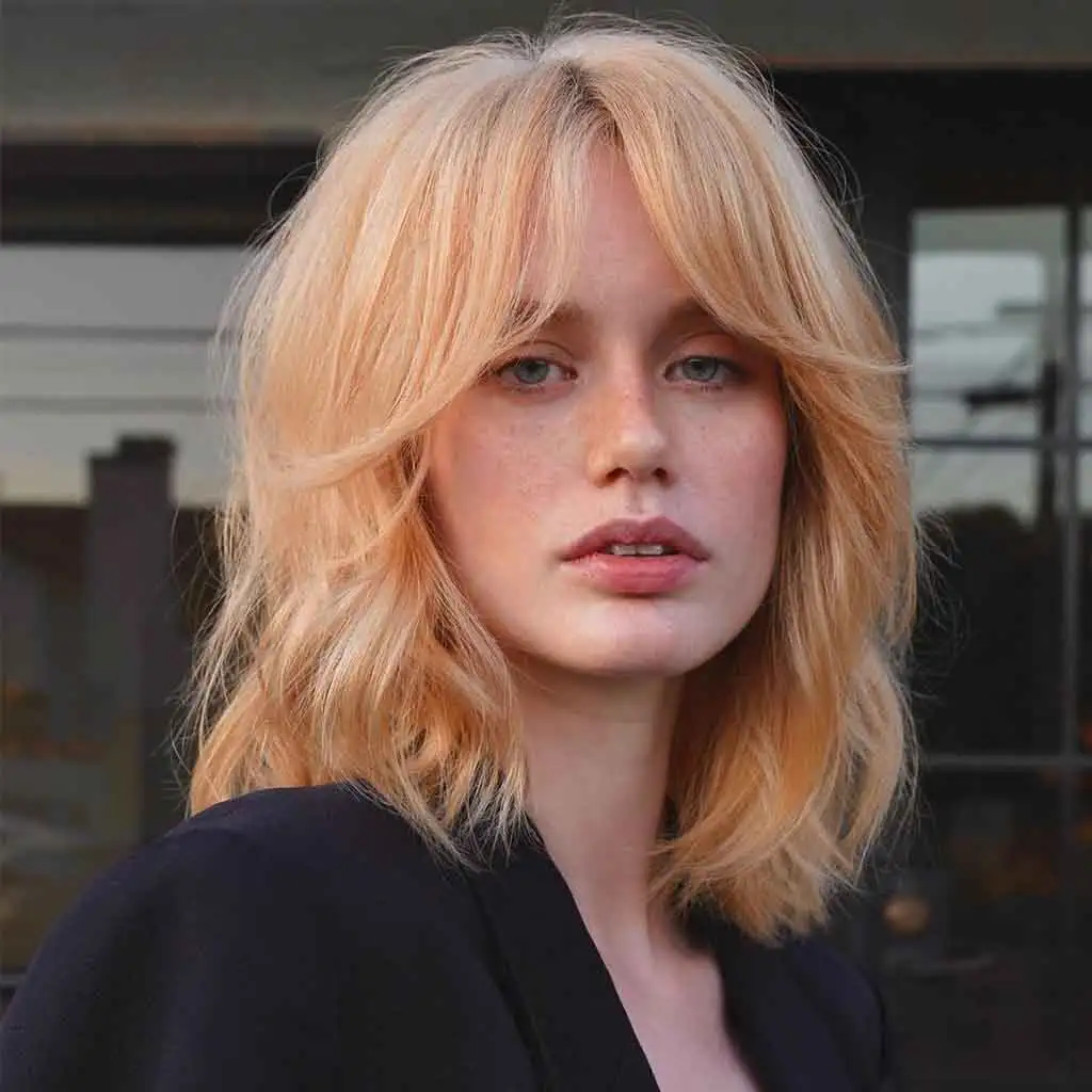 Shaggy Peach Blonde Lob With Curtain Bangs
