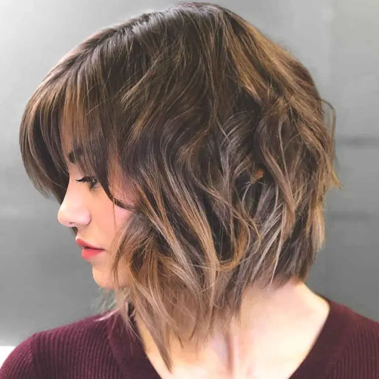 Tousled Bob Cut With Caramel Highlights and Bangs