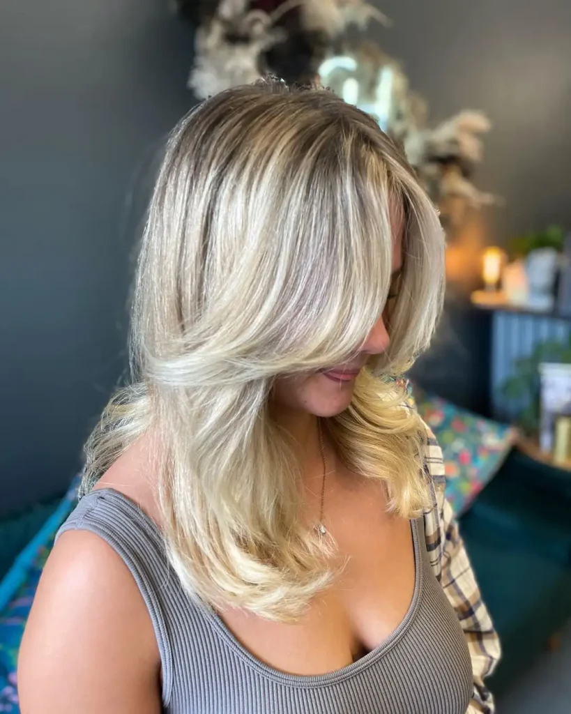 Bleached Blonde Fluffy Wolf Cut With Curtain Bangs