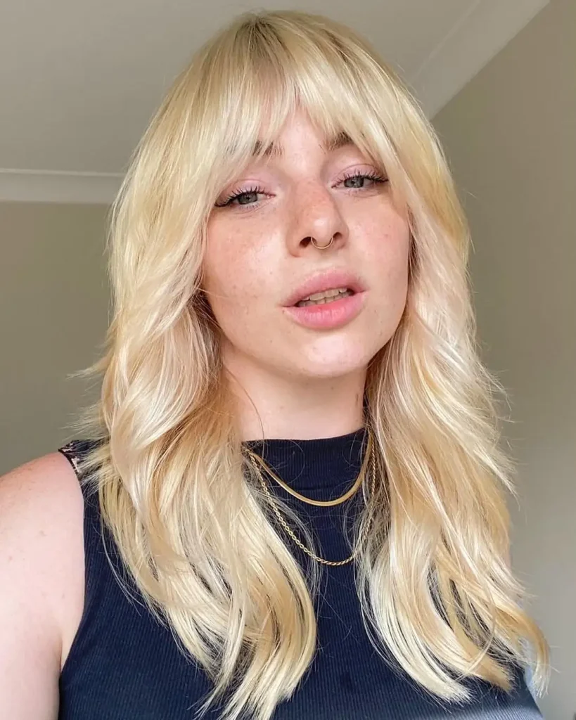 Long Blonde Wavy Wolf Cut with Asymmetric Bangs
