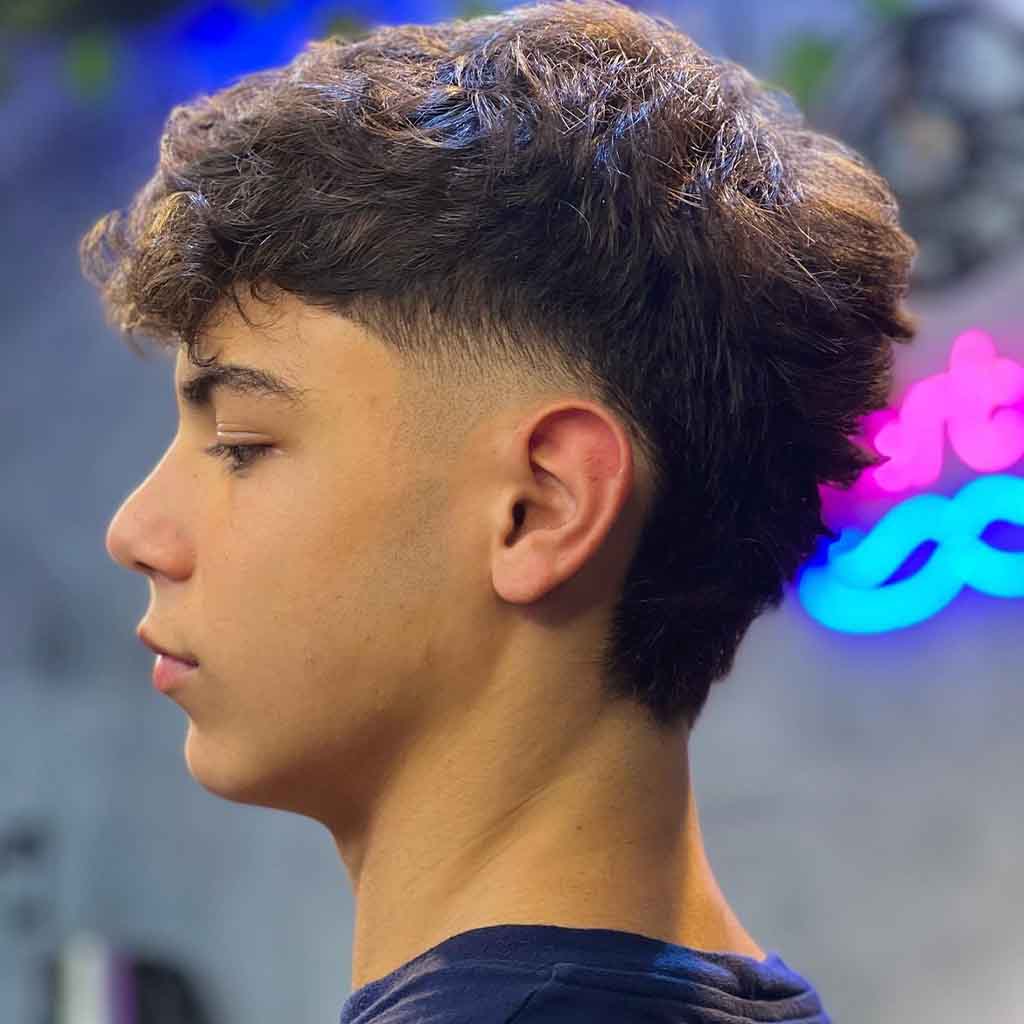 8. Low Taper Fade Tousled Mullet