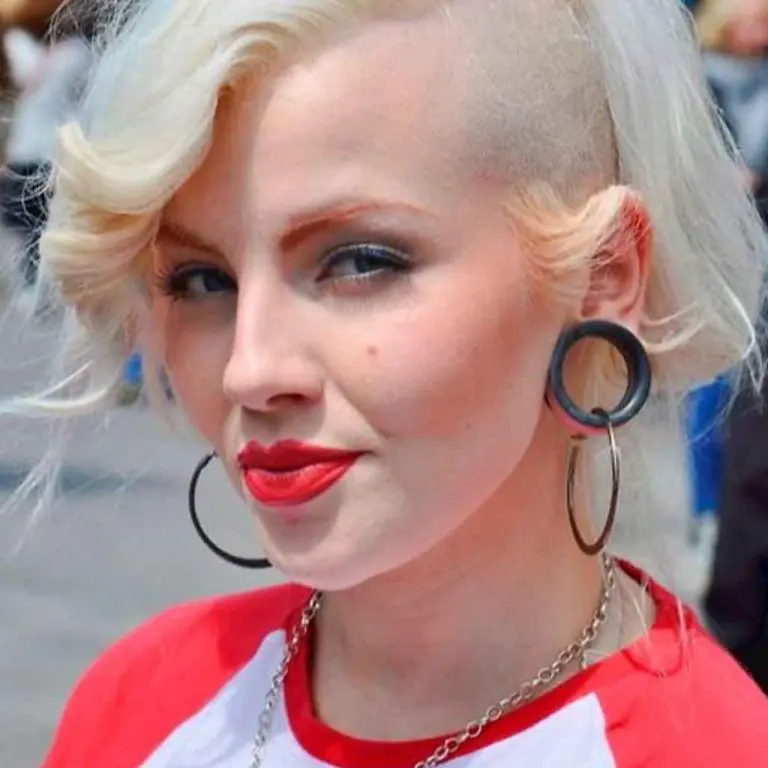 Bleached Blonde Wavy Side-Shaved Hairstyle