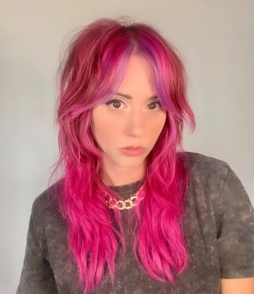 Long Shaggy Wolf Cut With Curtain Bangs on Pink Hair