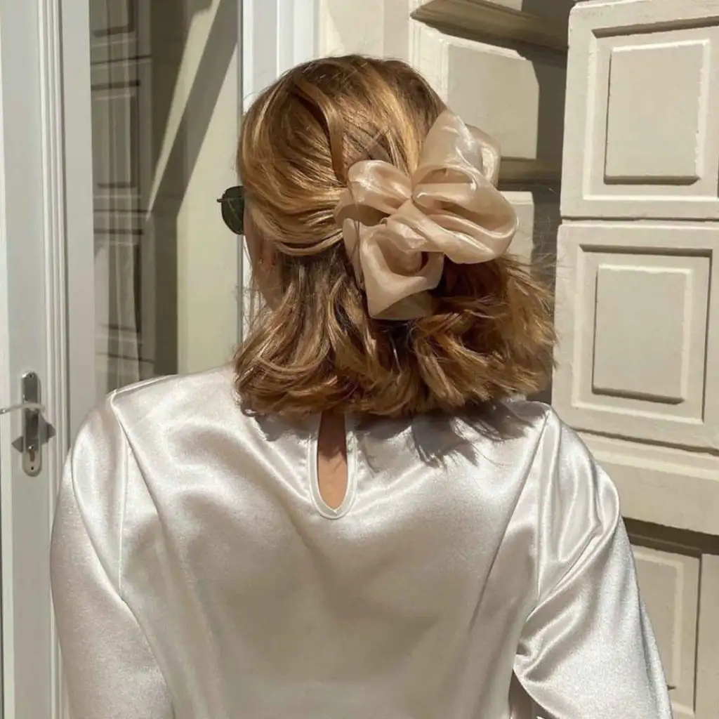 Parisian-Style Short Bronde Hair Tied With a Scrunchy