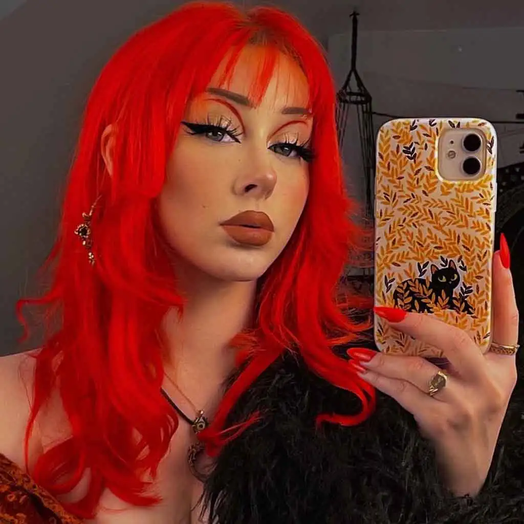 Medium Layered Bright Red Hair With Wispy Bangs