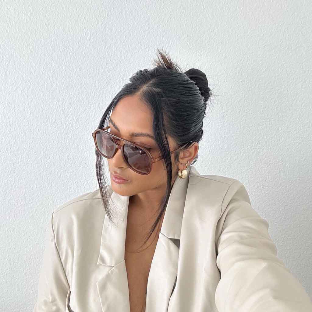Slicked Back Bun With Tendrils