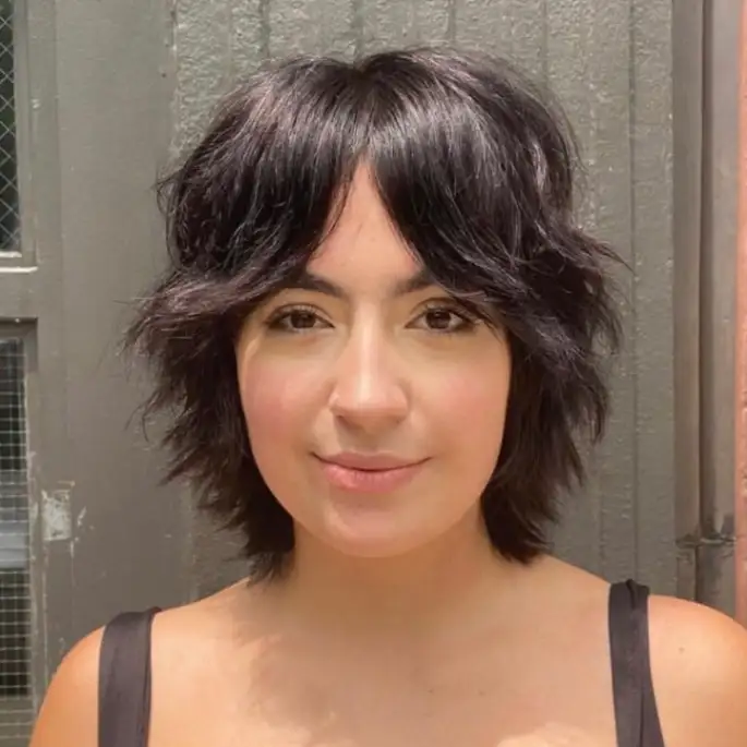 Short Black Shag Mullet Cut With a Sprinkle on Y2K