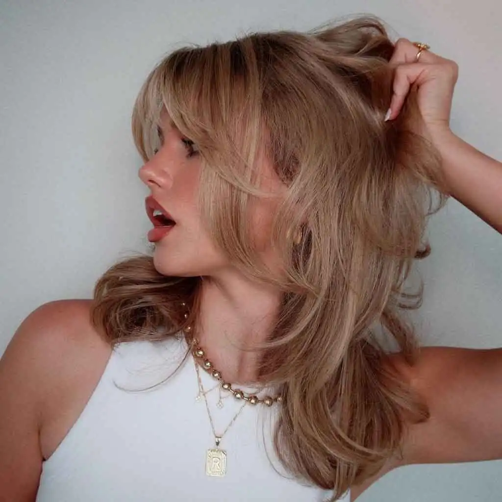 Ash Blonde Layered Shaggy Kitty Cut With Bangs