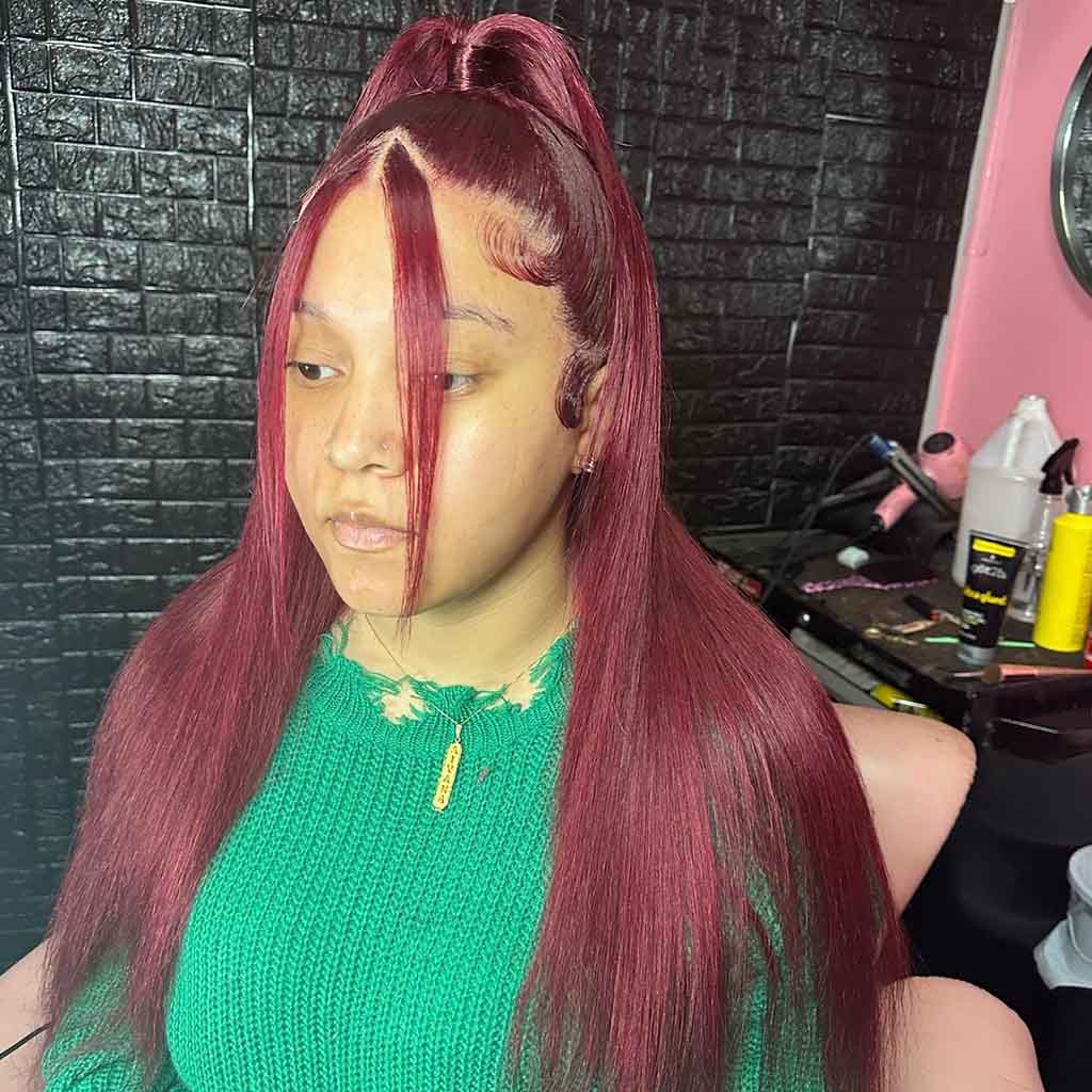 Half-Up Half-Down Burgundy Hair With Face Framing Tendrils