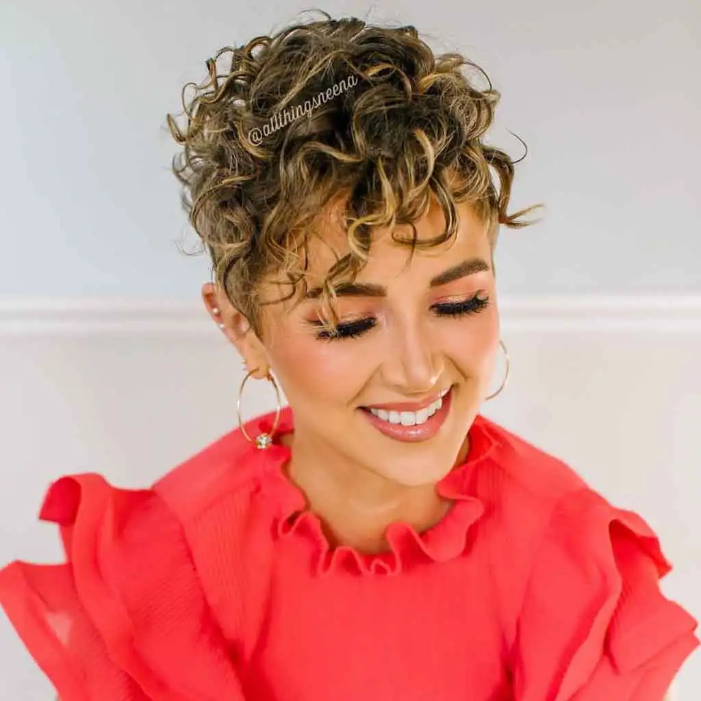 Curly Pixie Cut With Golden Highlights and Curly Bangs