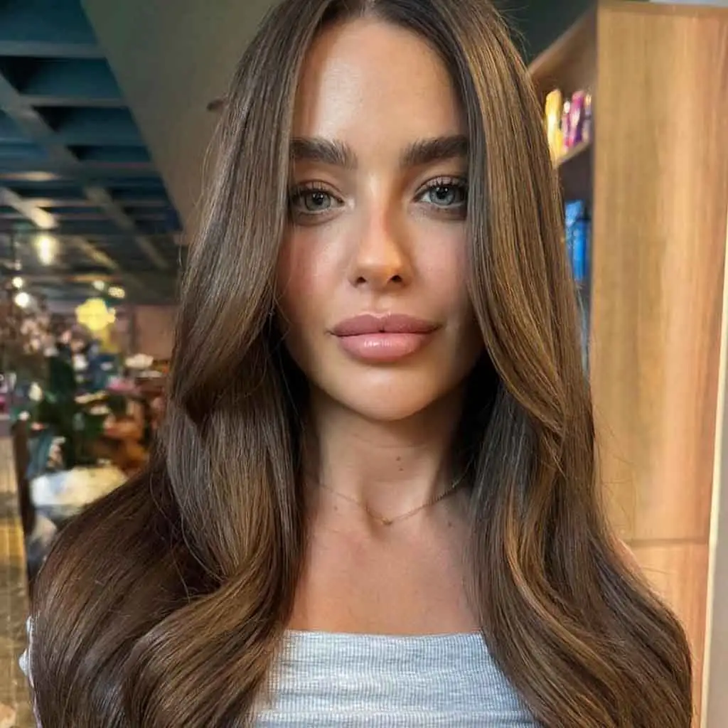 Shiny Honey Brunette on Long Wavy Hair