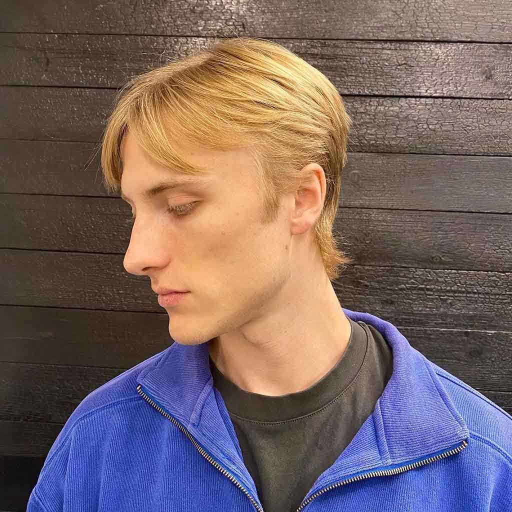 Blonde Mullet With Razor Cut and Curtain Bangs