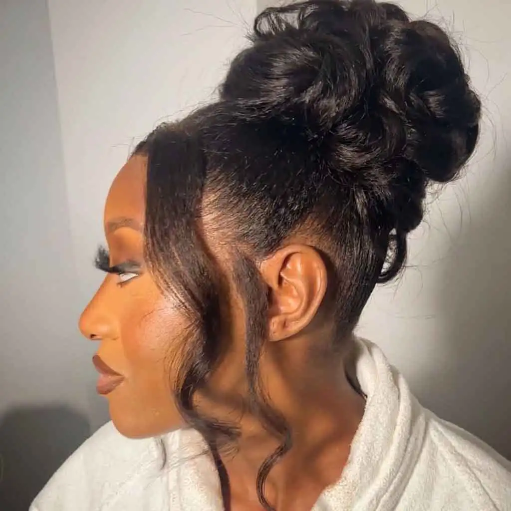 Fluffy Wavy Top Knot With Wavy Tendrils