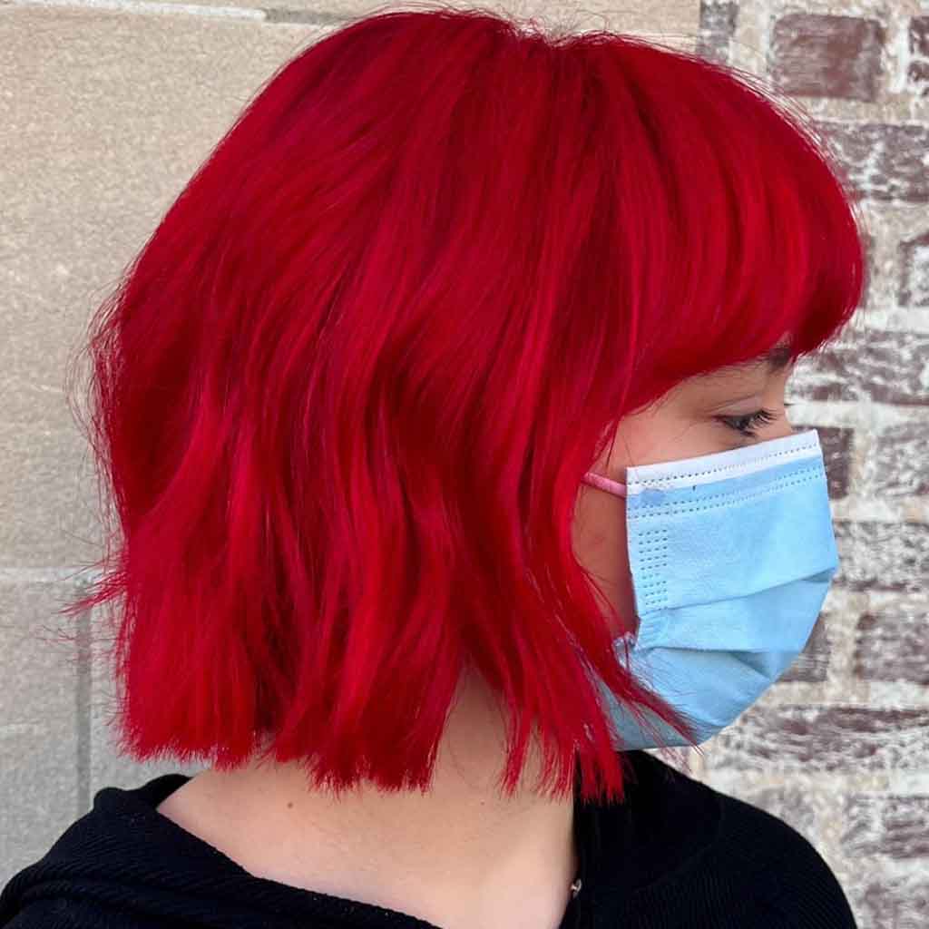 Short Vibrant Cherry Bomb Red Hair With Blunt Bangs
