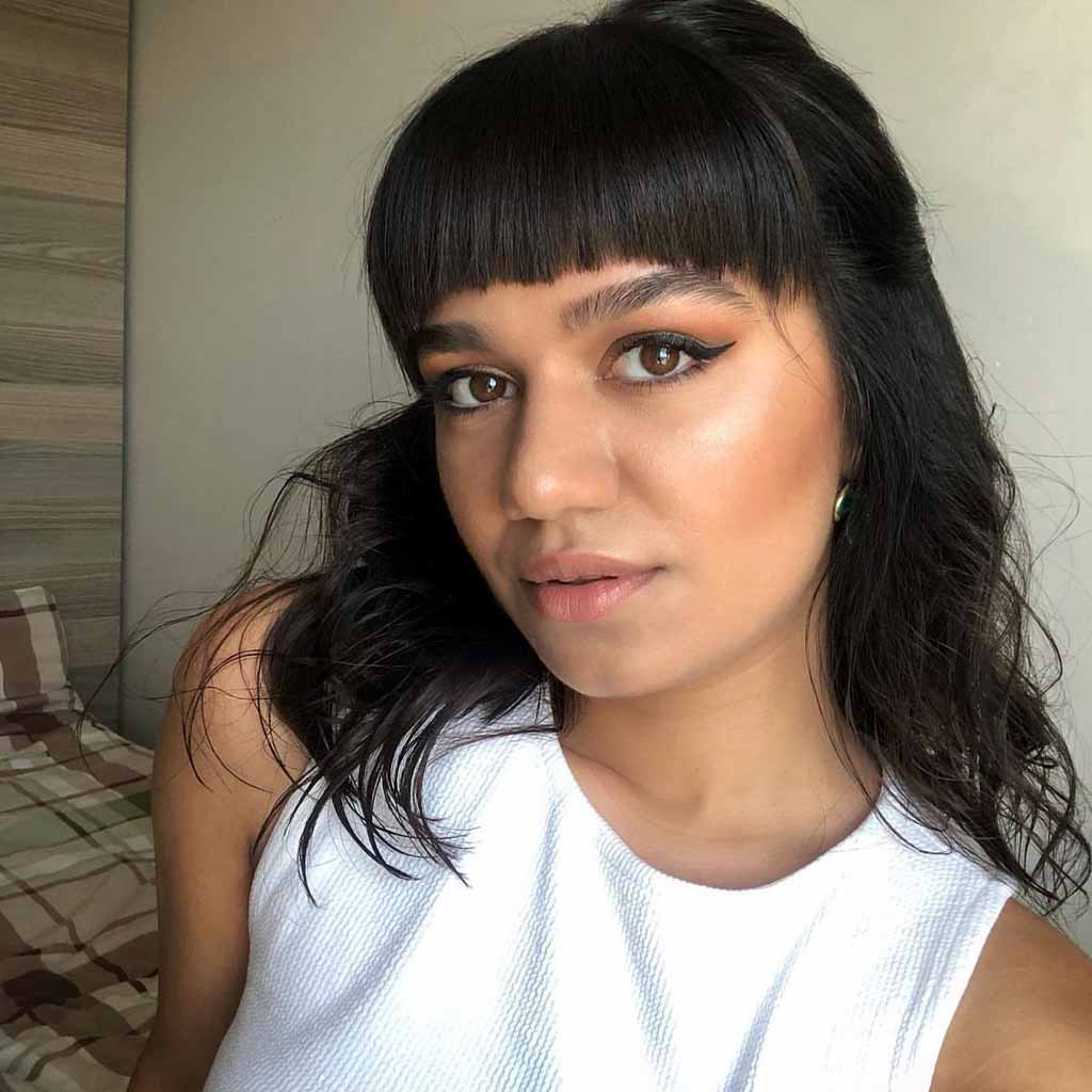 Black Medium Layered Hair With Blunt Bangs