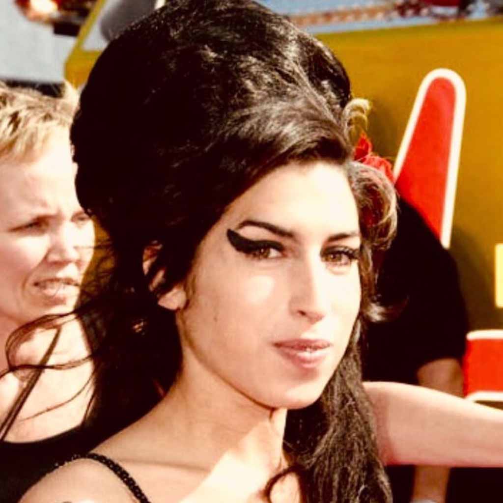Half-Up Beehive Hair With Side-Swept Bangs