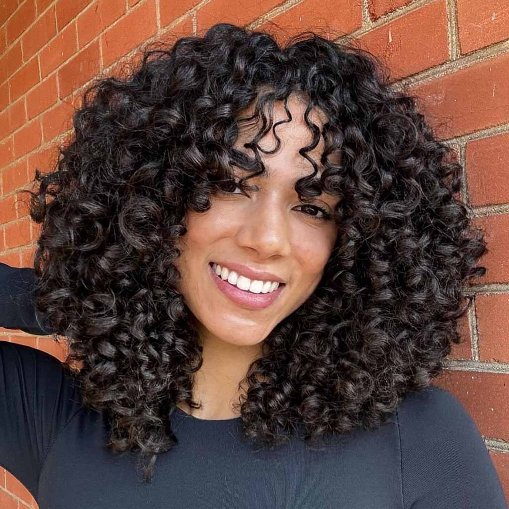 Medium Black Spiral Curls With Bangs