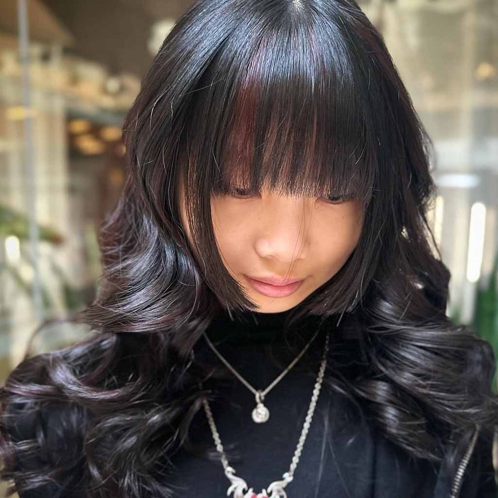 Layered Wavy Hime Cut With Maroon Highlights and Long Choppy Bangs