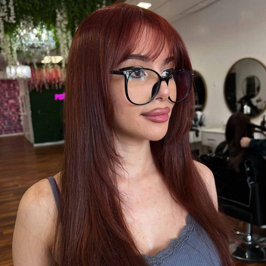 Straight Layered Ginger Brown Hair With Wispy Bangs