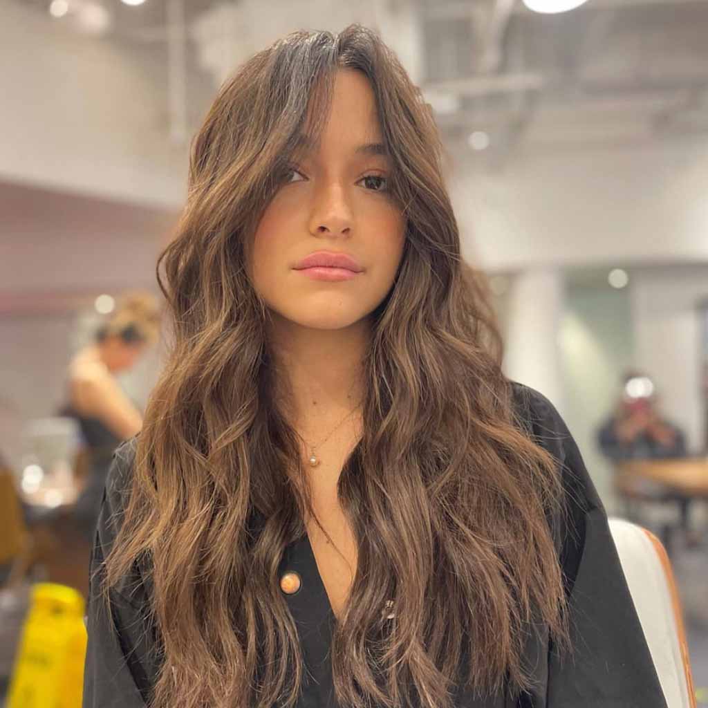 Long Layered Wavy Brunette Hair With Face Framing Layers