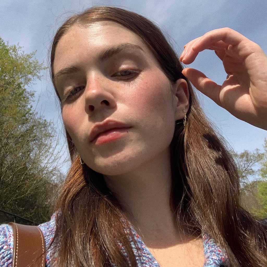 Wavy Brunette Hair Tucked Behind Ears