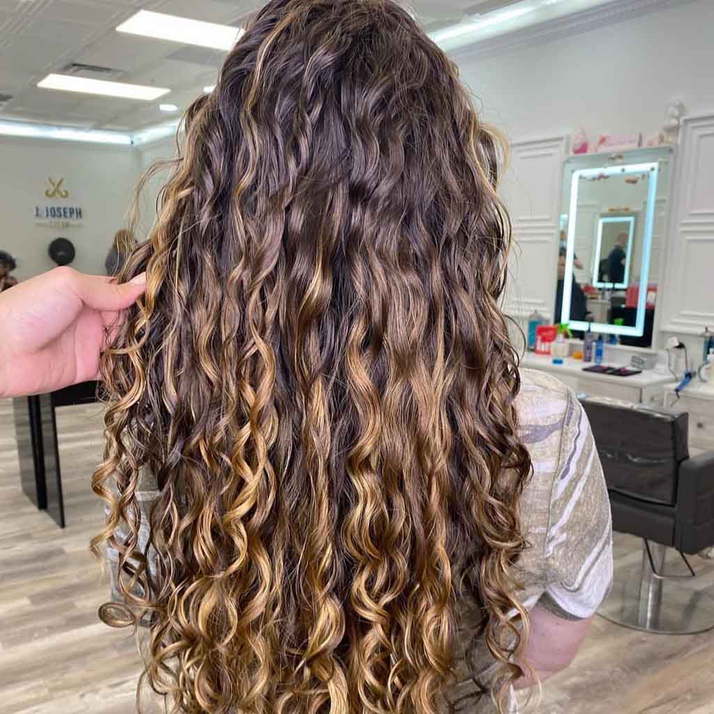 Brown Layered Curly Hair With Blonde Highlights