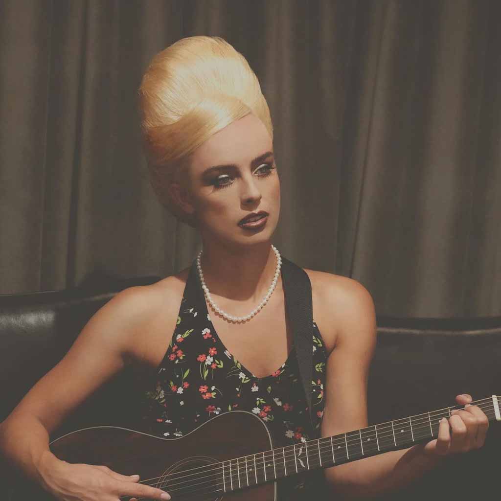 High Beehive Blonde Updo With Side Parted Front