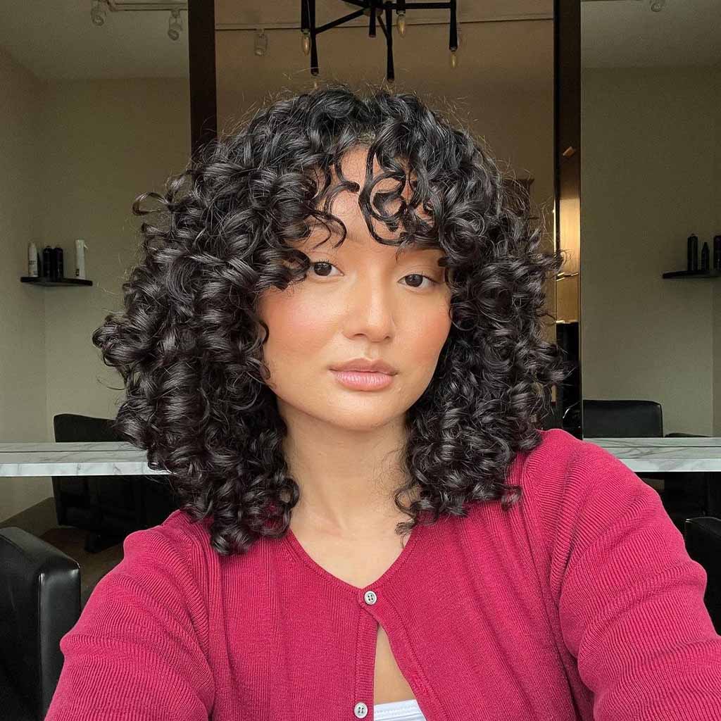 Medium Black Curly Layered Hair With Bangs