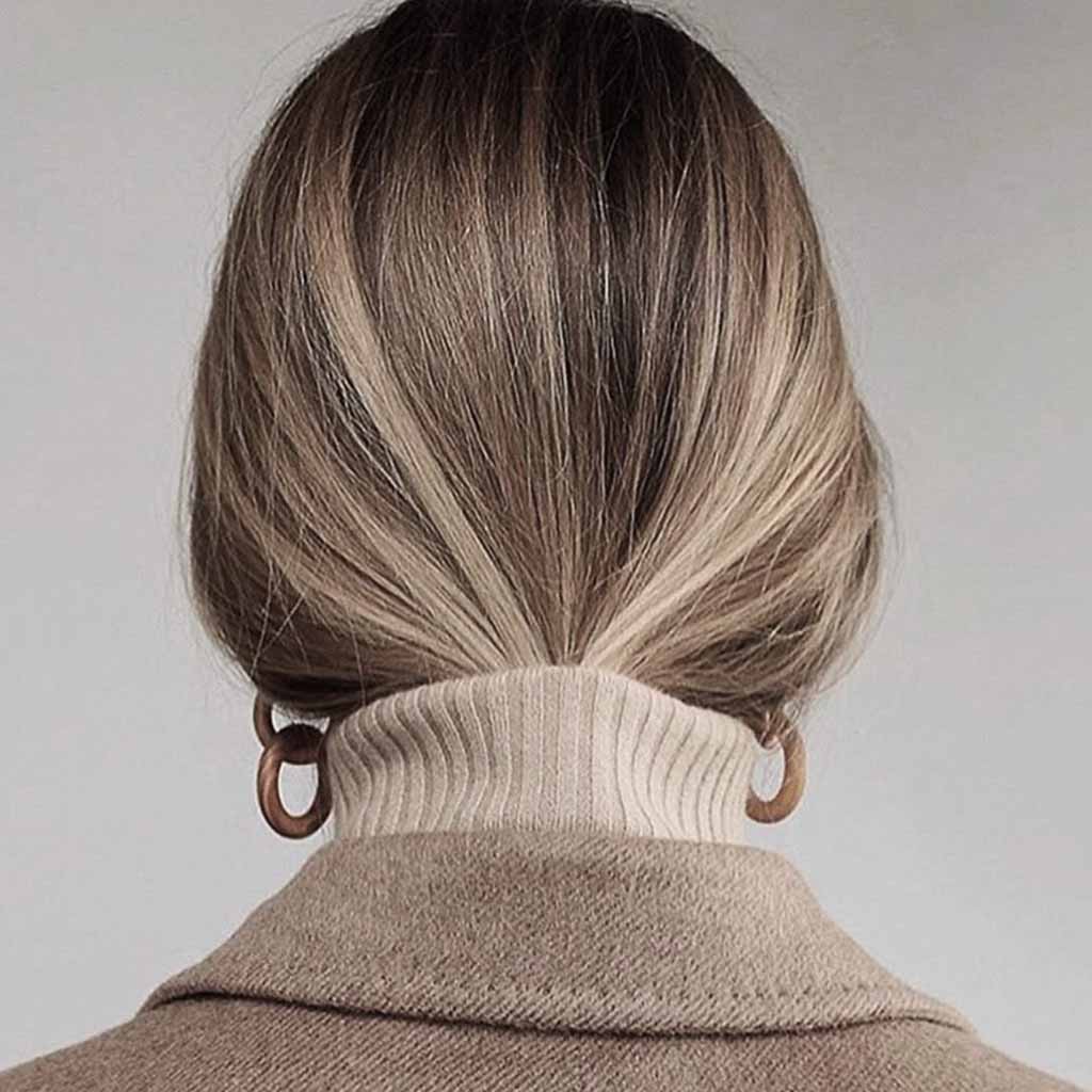 Bronde Hair Ponytail Tucked in a Sweater