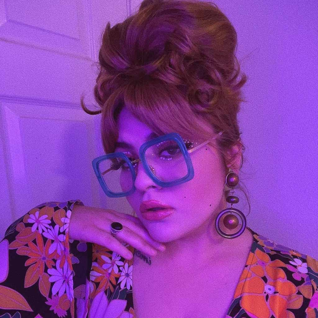 Wavy Brown Beehive Hairstyle With Curtain Bangs