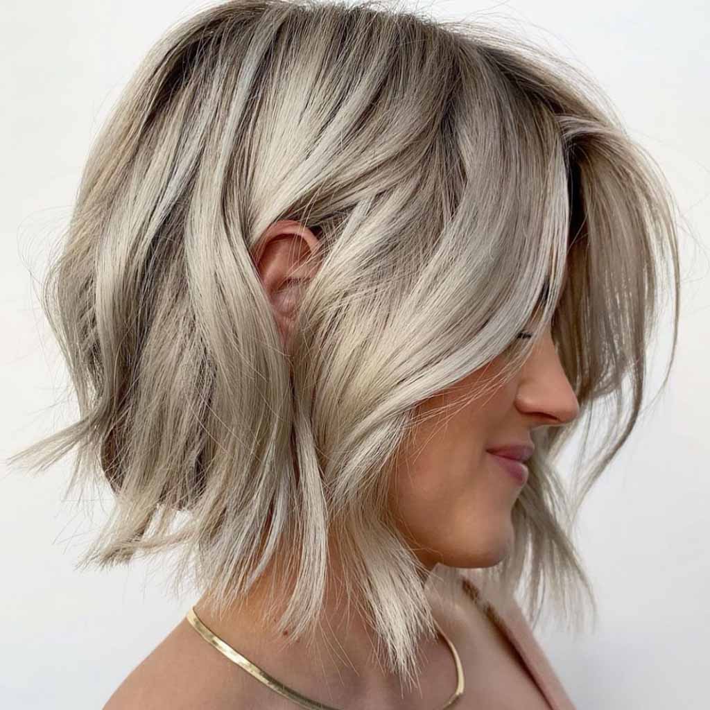 Wavy Ash Blonde Bob Hair Tucked Behind Ear