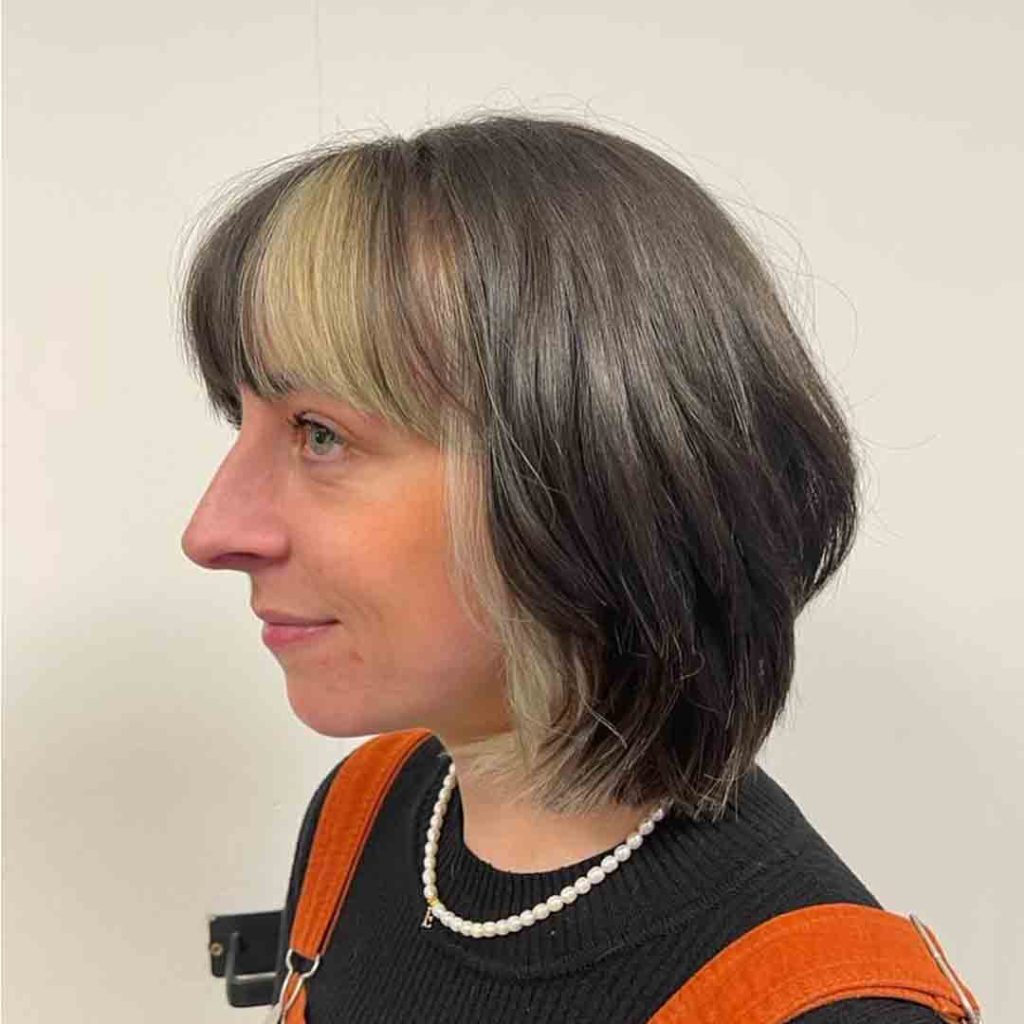 Short Wolf Cut With Blonde Skunk Stripes