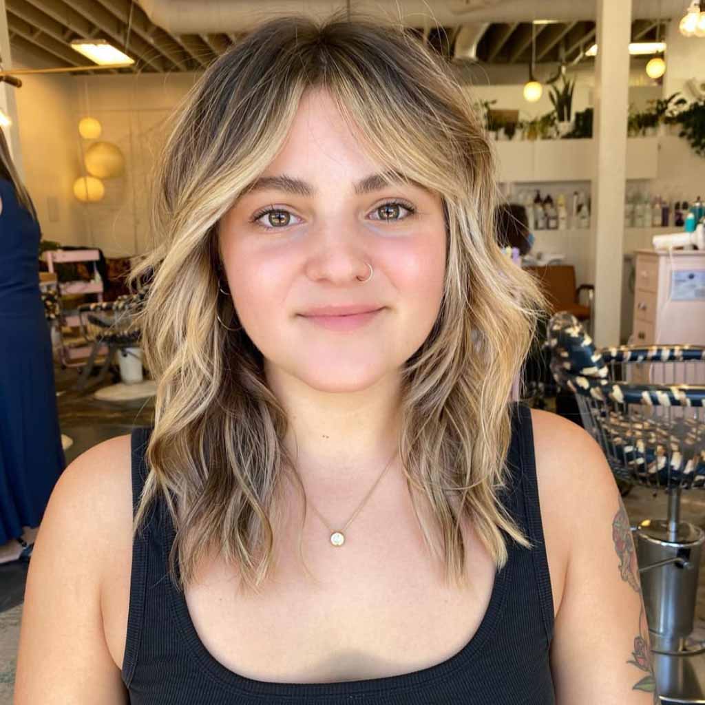 Layered Face-Framing Honey Blonde Hair With Curtain Bangs