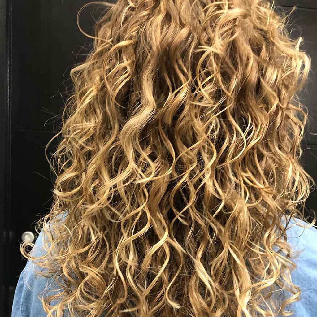 Blonde Curly Long Layered Balayage Hair