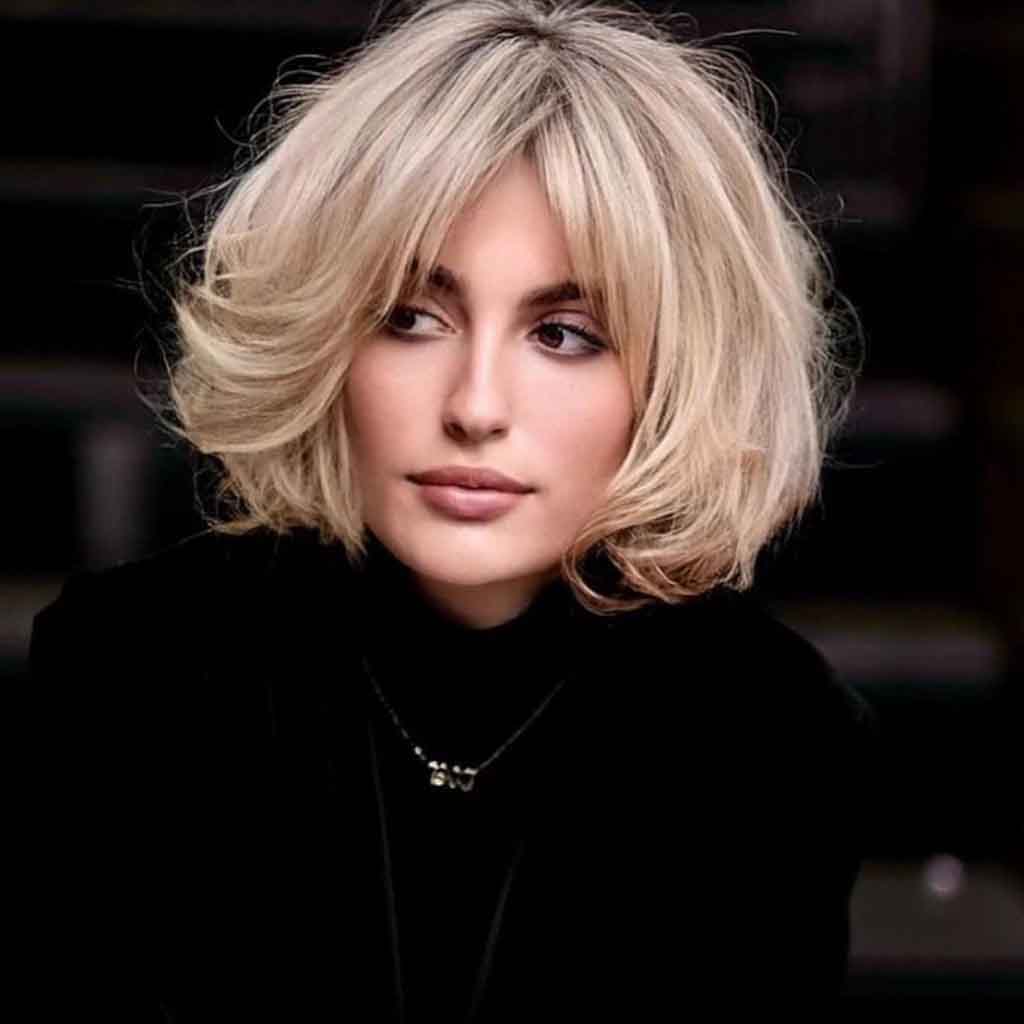 Fluffy Blonde Layered Bob With Curtain Bangs